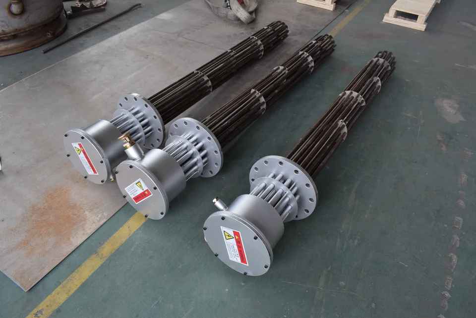 Three complete flanged heating assemblies with tube bundles, flanges and terminal housings